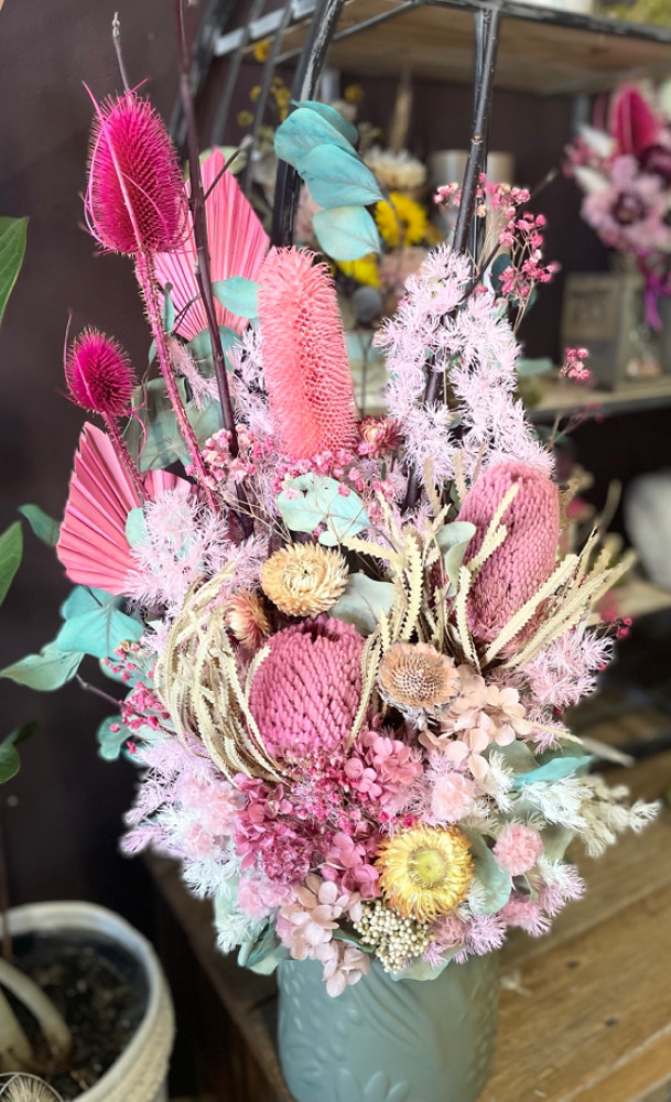 Preserved flower arrangement in pink tones