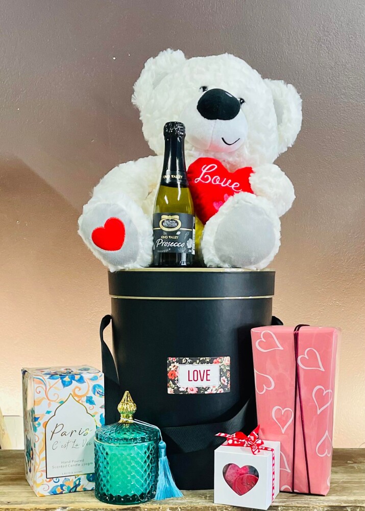 Hamper with Teddy Bear, Candle, Chocolate hearts, Cadbury Favourites, sparkling wine, presented in a black hat box