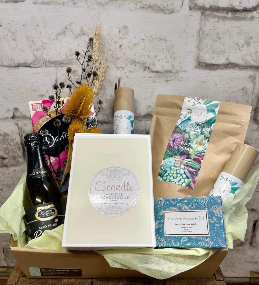 Hamper including candle, organic Australian made hand & body wash, moisturiser, hand & nail cream and bath soak, champagne and chocolate 
