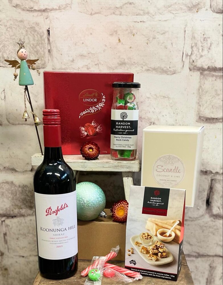 Hamper of Christmas Gifts | Candle, rock candy, chocolate, popcorn, wine, christmas ornaments
