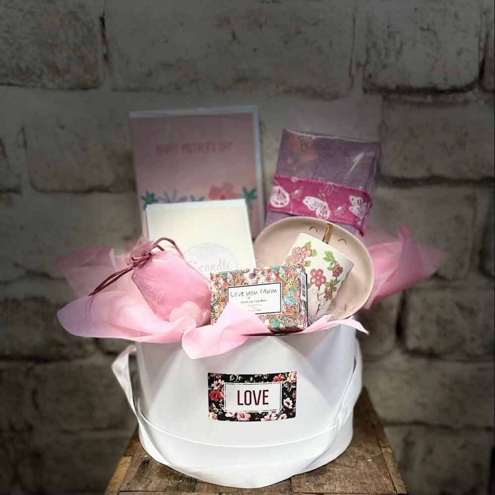 Hamper in Hat box including a candle, soap, chocolates, crystals and beautiful keepsakes