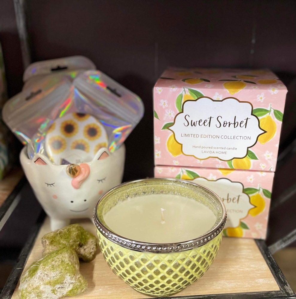 Hand poured candle in decorative coloured bowl